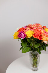 bouquet of roses on a table on a white background gift card