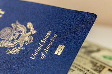 United States passport with dollar bills