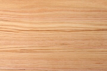 Texture of wooden cutting board as background, top view