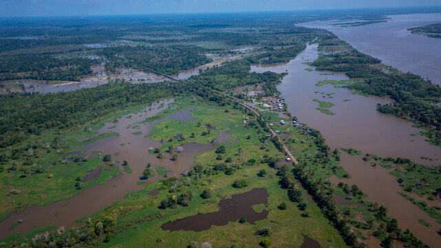 Aerial view of the BR 319 highway linking Manaus and Porto Velho in the Brazilian Amazon. The beginning of the route in Careiro da V&aacute;rzea is surrounded by wetlands and rainforest. Amazonas, Brazil