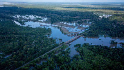 Aerial view of the BR 319 highway linking Manaus and Porto Velho in the Brazilian Amazon. The beginning of the route in Careiro da V&aacute;rzea is surrounded by wetlands and rainforest. Amazonas, Brazil