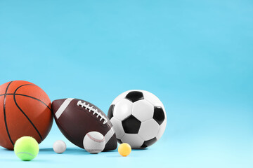 Many different sports balls on light blue background, space for text