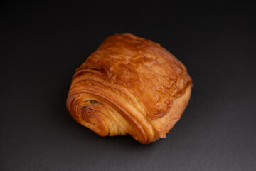 pain au chocolat isolated on a black background, chocolatine,  french sweet pastry speciality
