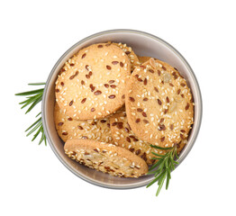 Round cereal crackers with flax, sunflower, sesame seeds and rosemary in bowl isolated on white, top view