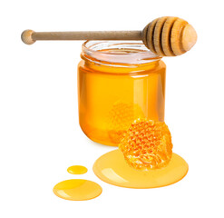 Natural honey in jar, wooden dipper and piece of honeycomb on white background