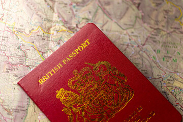 British passport on a paper map.