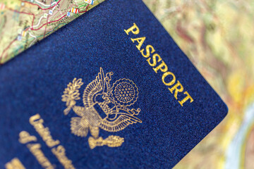 United States passport on a paper map.