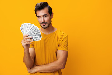 Success man rich money background smiling dollar hand currency finance yellow business cash surprised happy