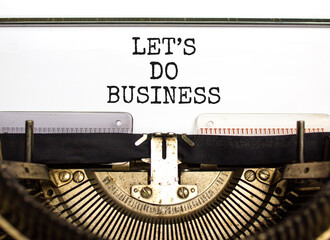 let is do business symbol. Concept words let is do business typed on beautiful old retro typewriter. Beautiful white paper background. let is do business concept. Copy space.
