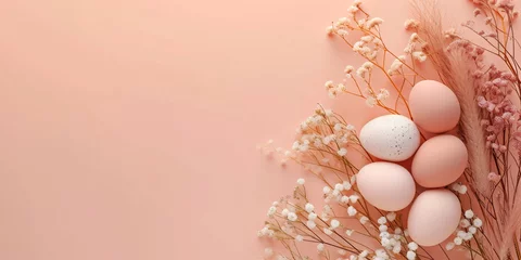 Foto op Canvas Banner of pastel peach fuzz colour Easter eggs cradled by smal white flowers against a soft peach background. Idea for minimalist spring themed decor and Easter celebrations © Silga