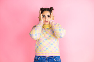 Young beautiful woman wearing casual sweater over isolated pink background thinking looking tired...