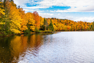 Lac-du-missionaire, Canada: Oct.10 2022: Morning fog on the lake of Lac-du-missionaire with...