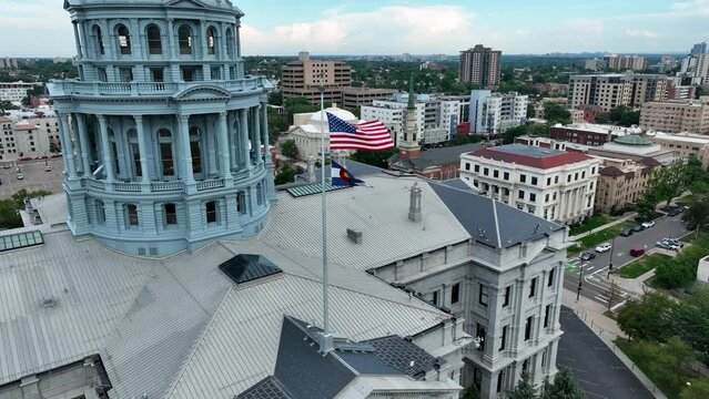 Drone Aerial Colorado State Capitol Building Flying Flags in Downtown Denver, Colorado 4K