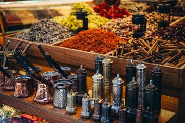 Turkish copper coffee pots and grinders, spices and tea on sale at one of the markets in Istanbul, Turkey. - 744172117