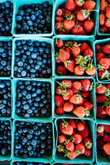 Berry Bliss: Fresh and Ripe Strawberries and Blueberries in Blue Eco-Friendly Packaging at Farmers Market