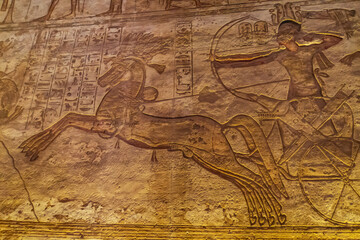Fototapeta na wymiar wall mural inside the Great Temple at Abu Simbel honoring Pharoah Ramses 11 as a great warrior 
