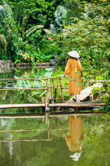 Woman by lake in Vietnam - 744184963