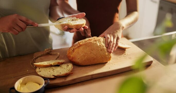 Couple, hands and cutting bread with butter, spread or roll for meal, snack or wheat in kitchen at home. Closeup of hungry people making food, morning breakfast or bun for healthy nutrition on table