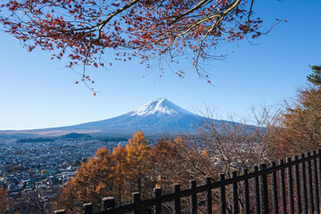 Mont Fuji beautiful view from Fujiyoshida in autumn with colorful maple leaves (momiji), Japan
