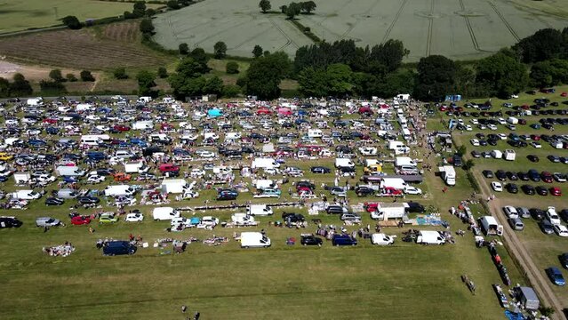Aerial Video Of People Moving Around At A Car-Boot In Fitzwilliam, West Yorkshire, England Uk and car park for customers, footage taken in summer time