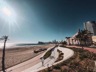 In the vast expanse of uncertainty, an elder walks, his steps echoing resilience, amidst a city as...