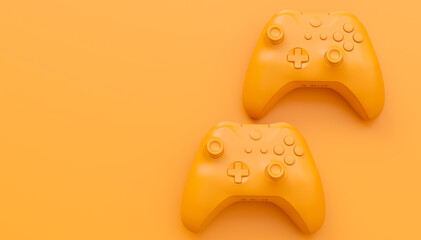 Video game joysticks or gamepads in plain monochrome yellow color background © Vasyl Onyskiv