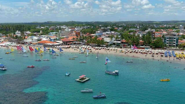 Porto de Galinhas is well-known for its white sand beaches, natural pools that contain colorful fish, reefs, and warm water year-round. Beach. Brazil.