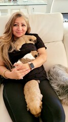 Woman Holding Puppies