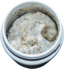 Spoiled expired products and covered with mold in an open jar