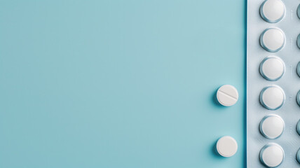 Medication pills neatly placed on a blue background