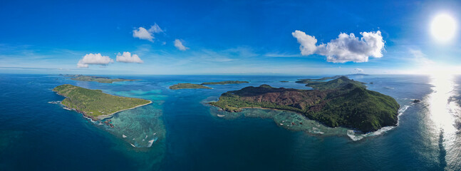 Coral reef from above - Aerial view of healthy coral reef and tropical Island in the South Pacific...