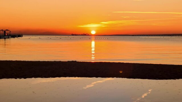 Morning Sunrise Over Nabq Bay with Orange Skies and Reflections, Egypt.