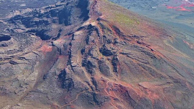 Drone view, ascending from bottom to top movement on Piton Chisny in the Plaine des Sables volcanic plain, R&eacute;union Island.