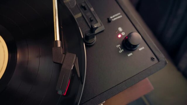 Overhead shot of a vintage  turntable record player playing a vinyl record