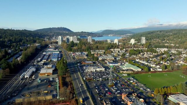 Barnet Road In The City Of Port Moody In British Columbia, Canada. Burrard Inlet In Distant View. aerial shot