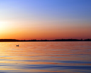 Obraz premium sunset over the river