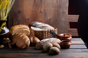 Lots of different breads on a dark wooden background