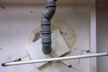 There is a leak on the ceiling of the fan pipe of the sewer.The neighbors from the top floor poured...