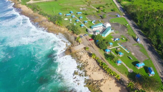 Aerial footage of coastal building and park in Campamento Pinones, Carolina, Loiza, Puerto Rico
