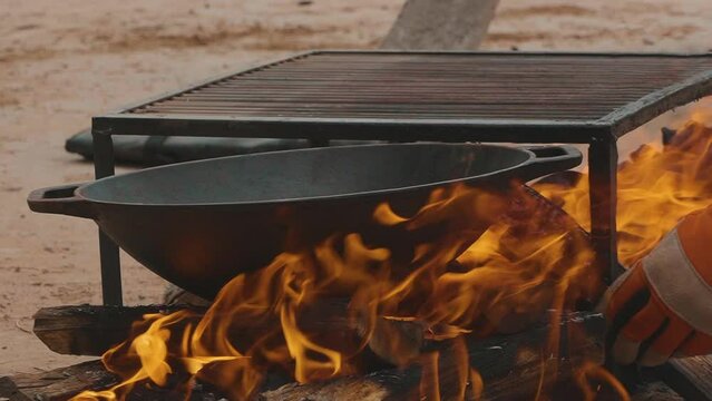 Firewood burning - slow motion video of Tongues of fire and smoke from coals in the grill. Preparing the Paraguayan barbecue