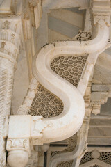 Agra, Uttar Pradesh / India - February 7, 2012 : White marble serpentine brackets of the tomb of the saint Salim Chishti at Jama Masjid in Fatehpur Sikri, Agra. © Shyamal