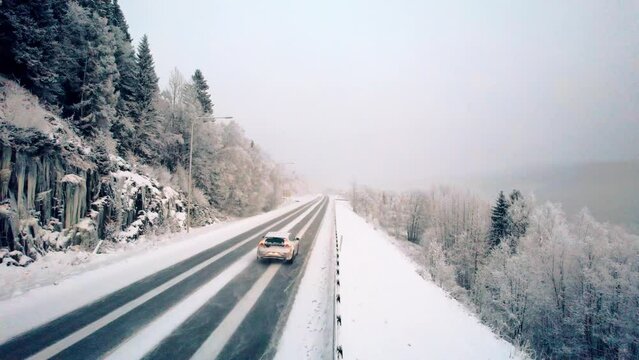 Volvo car driving in a cold landscape