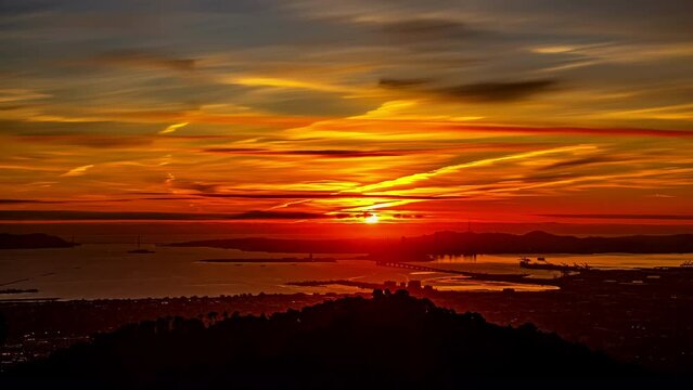 San Francisco Sunrise Time Lapse with Orange and Yellow Skies Across Oakland Viewpoint.