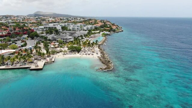 Jan thiel beach in curacao with clear turquoise water, aerial view