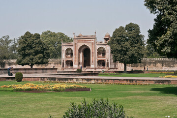 AGRA, UTTAR PRADESH / INDIA - FEBRUARY 27, 2012 : VIEW OF A GARDEN AND ONE OF A ENTRANCE  DOOR IN...