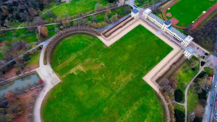 Aerial around the Orangerie of the city Kassel in Hessen, Germany on a cloudy day in early spring	
