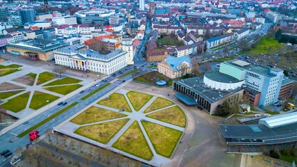 Aerial around the downtown of the city Kassel in Hessen, Germany on a cloudy day in early spring	