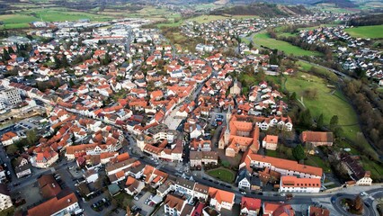 Aerial view around the old town of the city Schlüchtern in Hessen Germany on a sunny day in early spring	 - obrazy, fototapety, plakaty