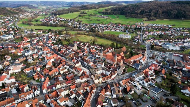 Drone aerial view of the city Schlüchtern in Germany. The old town during a sunny day in late winter