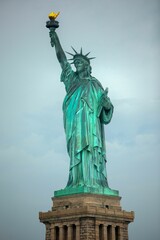 Fototapeta premium Statue of Liberty standing against an overcast sky